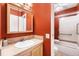 This vibrant bathroom features a single vanity with bright and clean finishes at 628 S Carr St, Lakewood, CO 80226