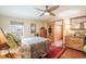 Tranquil bedroom with hardwood floors, ceiling fan, and natural light at 1205 Lee St, Lakewood, CO 80215