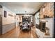 Beautiful dining room with hardwood floors, a fireplace, and a decorative light fixture at 1205 Lee St, Lakewood, CO 80215