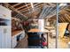 Rustic garage interior featuring work benches, storage cabinets, and an open layout, perfect for hobbies and projects at 1205 Lee St, Lakewood, CO 80215