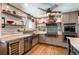 Well-lit kitchen with a stainless steel dishwasher, gas stove, and plenty of storage space at 1205 Lee St, Lakewood, CO 80215