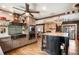 Kitchen featuring stainless steel appliances, center island, hardwood floors, and a decorative ceiling fan at 1205 Lee St, Lakewood, CO 80215