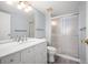 Renovated bathroom with a white vanity, modern fixtures, and a glass-enclosed shower at 13952 E Marina Dr # 310, Aurora, CO 80014