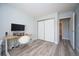 Bedroom featuring an office setup, closet, and bathroom view at 13952 E Marina Dr # 310, Aurora, CO 80014