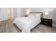 Comfortable bedroom with hardwood floors, ensuite bathroom, and ample natural light at 13952 E Marina Dr # 310, Aurora, CO 80014