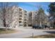Exterior view of building with parking and mature landscaping at 13952 E Marina Dr # 310, Aurora, CO 80014