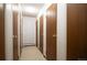 Hallway featuring multiple unit doors and carpeted flooring at 13952 E Marina Dr # 310, Aurora, CO 80014