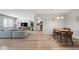 Spacious living room and dining area adjacent to kitchen with hardwood floors at 13952 E Marina Dr # 310, Aurora, CO 80014