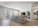 Inviting living room with access to a balcony and a view into the kitchen at 13952 E Marina Dr # 310, Aurora, CO 80014
