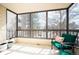 Comfortable screened porch with seating and a view of the outdoors at 13952 E Marina Dr # 310, Aurora, CO 80014