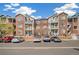 Apartment complex in an urban setting with parking out front and blue sky background at 2662 S Cathay Way # 302, Aurora, CO 80013
