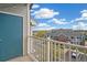 Balcony overlooking a residential neighborhood, showcasing nearby apartment buildings and a glimpse of the horizon at 2662 S Cathay Way # 302, Aurora, CO 80013