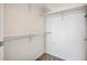 Walk-in closet featuring shelving and clothes rod with carpeted flooring at 2662 S Cathay Way # 302, Aurora, CO 80013