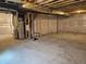 Spacious unfinished basement with insulated walls and exposed utilities at 6077 Idlewild Pl, Brighton, CO 80601