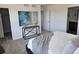 Spacious bedroom featuring stylish decor, soft carpet, and convenient access to the bathroom and closet at 6077 Idlewild Pl, Brighton, CO 80601