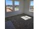 New carpeted bedroom featuring bright natural light from three large windows at 6077 Idlewild Pl, Brighton, CO 80601
