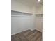 Walk-in closet offering ample storage space with installed rods, and soft carpet at 6077 Idlewild Pl, Brighton, CO 80601