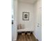 Welcoming entryway with a built-in bench, decorative pillows, and stylish artwork at 6077 Idlewild Pl, Brighton, CO 80601