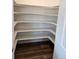 Walk-in pantry with ample shelving, perfect for organized storage and easy access at 6077 Idlewild Pl, Brighton, CO 80601