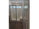 New bathroom shower with frameless glass door, bench, tiled surround and tile floor at 6077 Idlewild Pl, Brighton, CO 80601