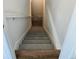 Staircase view from top to bottom at 6077 Idlewild Pl, Brighton, CO 80601