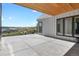Large back patio with beautiful views and a wood ceiling at 2230 Rim Ridge Dr, Castle Pines, CO 80108