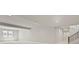 Spacious, unfinished basement with natural light and staircase at 2230 Rim Ridge Dr, Castle Pines, CO 80108