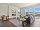 Inviting living room showcasing a cozy fireplace, stylish furnishings, and large windows with scenic views at 2230 Rim Ridge Dr, Castle Pines, CO 80108
