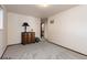 Large carpeted bedroom with natural light and a dark wood dresser at 3752 S Rosemary Way, Denver, CO 80237