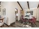 Dining area with vaulted ceilings, exposed beams, and a stylish table set at 3752 S Rosemary Way, Denver, CO 80237