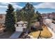 Traditional two-story home with well-manicured front lawn, mature trees and attached two-car garage at 3752 S Rosemary Way, Denver, CO 80237