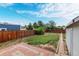 Spacious backyard featuring a paver patio, lawn, and wood fence at 436 S 4Th Ave, Brighton, CO 80601