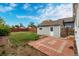 Backyard with a detached garage, patio, and privacy fence for outdoor living and entertaining at 436 S 4Th Ave, Brighton, CO 80601