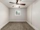 Neutral bedroom with carpet, ceiling fan and a bright, natural light filled window at 436 S 4Th Ave, Brighton, CO 80601