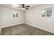 Neutral bedroom with carpet, ceiling fan and a pair of bright, natural light filled windows at 436 S 4Th Ave, Brighton, CO 80601
