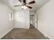 This bedroom boasts neutral walls and carpeting and has a window, fan and closet at 436 S 4Th Ave, Brighton, CO 80601