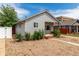 Charming single-story home with mature landscaping, gravel front yard, and inviting walkway at 436 S 4Th Ave, Brighton, CO 80601