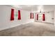Bright living room features carpet flooring, natural lighting, and white trim at 436 S 4Th Ave, Brighton, CO 80601