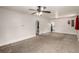 Neutral living room with ceiling fan, white walls, gray carpet and archways to adjacent rooms at 436 S 4Th Ave, Brighton, CO 80601