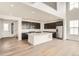 Modern kitchen with stainless steel appliances, a large island, and sleek dark cabinetry at 39440 Congress Ln, Elizabeth, CO 80107