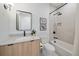 Modern bathroom with a walk-in shower, bathtub, and floating vanity at 5098 E Donald, Denver, CO 80222