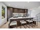 Contemporary kitchen with dark wood cabinets and an island at 5098 E Donald, Denver, CO 80222