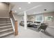 Finished basement with cozy living area, neutral color palette and plush gray carpeting at 777 Whispering Oak Dr, Castle Rock, CO 80104