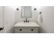 A stylish powder room includes modern fixtures and a sleek vanity with marble countertop at 777 Whispering Oak Dr, Castle Rock, CO 80104