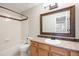 Traditional bathroom with a vanity, toilet, and bathtub with a shower at 777 Whispering Oak Dr, Castle Rock, CO 80104