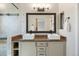 Double sink bathroom with mosaic tiles and framed mirrors at 777 Whispering Oak Dr, Castle Rock, CO 80104