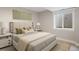 Serene bedroom with neutral tones, soft lighting, and plush bedding creating a peaceful retreat at 777 Whispering Oak Dr, Castle Rock, CO 80104