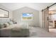 Serene main bedroom with sliding barn door to the en-suite bathroom at 777 Whispering Oak Dr, Castle Rock, CO 80104
