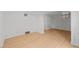 Spacious basement featuring light wood flooring and white painted brick walls at 14 S Lincoln St # 16, Denver, CO 80209