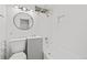 Bright bathroom featuring a shower-over-tub combination and stylish circular mirror at 14 S Lincoln St # 16, Denver, CO 80209